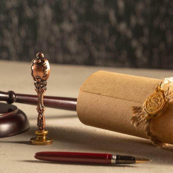 Gavel Notary's public pen and stamp on testament and last will. Notary public tools
